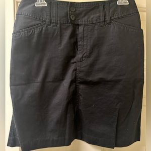 Black, fly button and zipper skirt by GAP. Versatile. Casual or business.